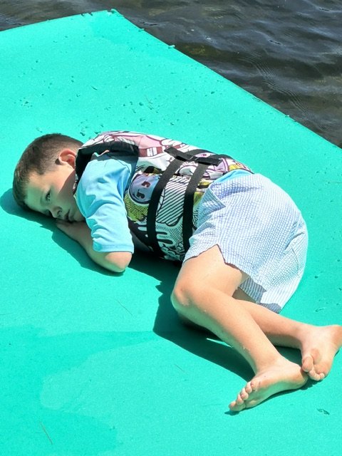 Resting on a floating mat on the lake